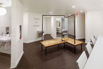 a room with a wooden table and a mirror